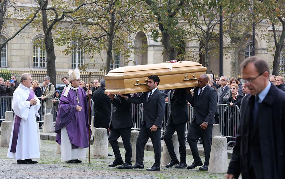Pallbearers carry the coffin of former Total SA Chief Executive Christophe de Margerie before a funeral service at Saint Sulpice church in Paris, France.