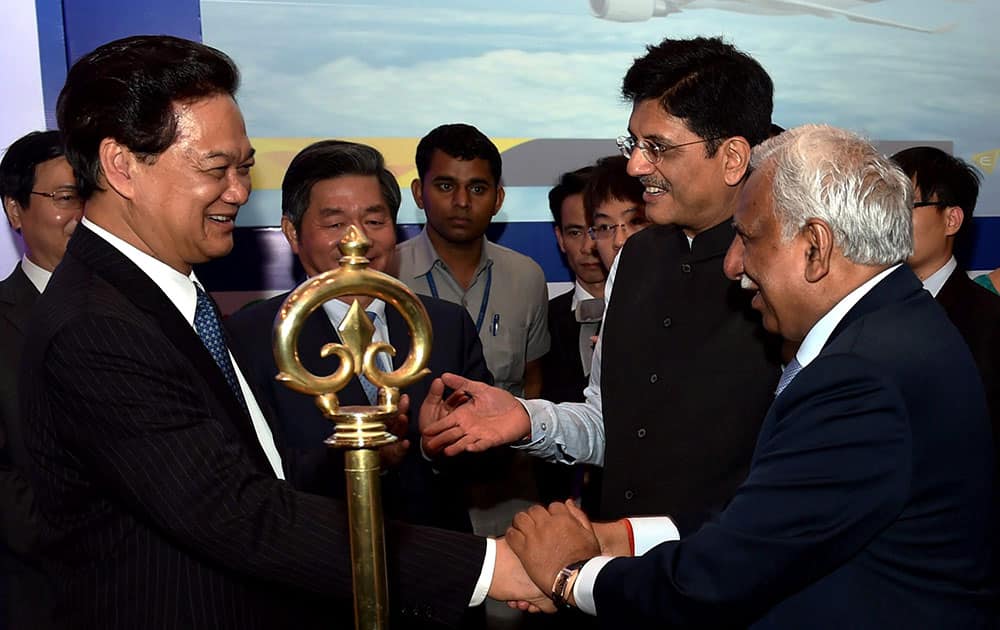 Prime Minister of Vietnam Nguyen Tan Dung shakes hands with Jet Airways chairman Naresh Goyal during India- Vietnam Trade and Investment Forum in New Delhi. Minister of State for Power, Coal and New & Renewable Energy Minister Piyush Goyal can also be seen.