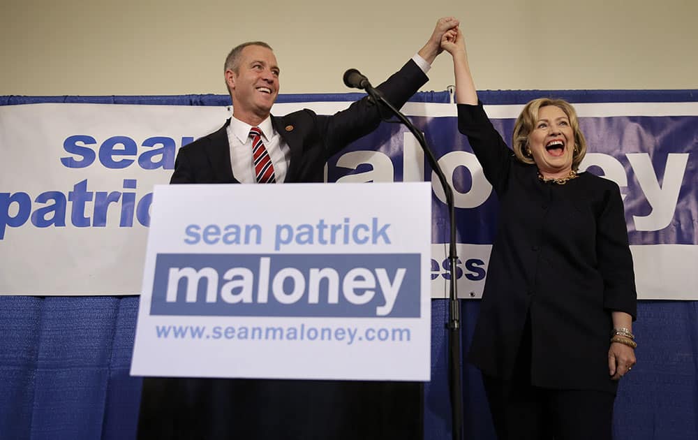 Rep. Sean Maloney holds hands with former Secretary of State Hillary Rodham Clinton during a `Women for Maloney` event in Somers, NY.
