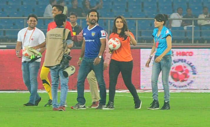 Parineeti Chopra (C) and Dinesh Karthik (2R) during a match between Delhi Dynamos and Chennaiyin FC in Indian Super League (ISL) football match in New Delhi. -dna