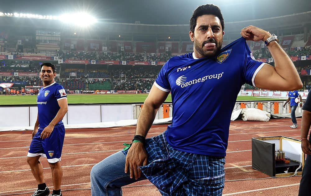 Chennaiyin FC co owner Abhishek Bachchan shows a dance step during the Indian Super League match between Chennaiyin FC and Mumbai City FC, in Chennai.