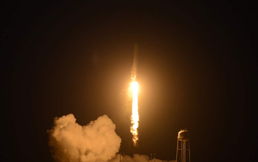 An unmanned Orbital Sciences Corp.'s Antares rocket headed for the International Space Station lifts off from the Wallops Flight Facility on Wallops Island, Va.