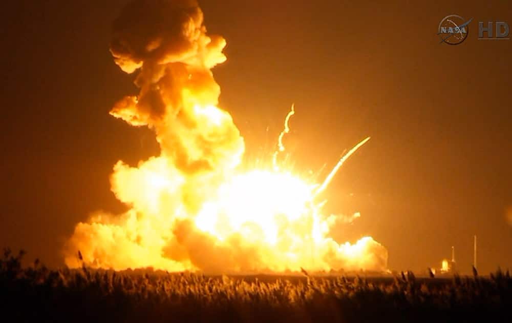 This image taken from video provided by NASA TV shows Orbital Sciences Corp.'s unmanned rocket blowing up over the launch complex at Wallops Island, Va., just six seconds after liftoff. The company says no one was believed to be hurt and the damage appeared to be limited to the facilities.