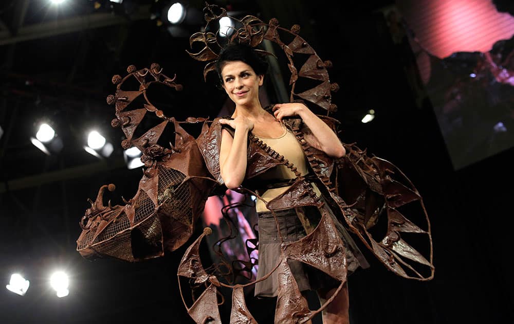 A model presents a chocolate studded dress during a show as part of the chocolate fair in Paris.