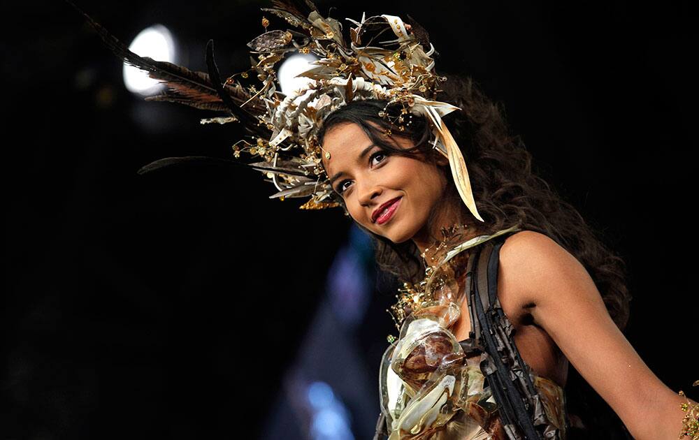 A model presents a chocolate studded dress during a show as part of the chocolate fair in Paris.