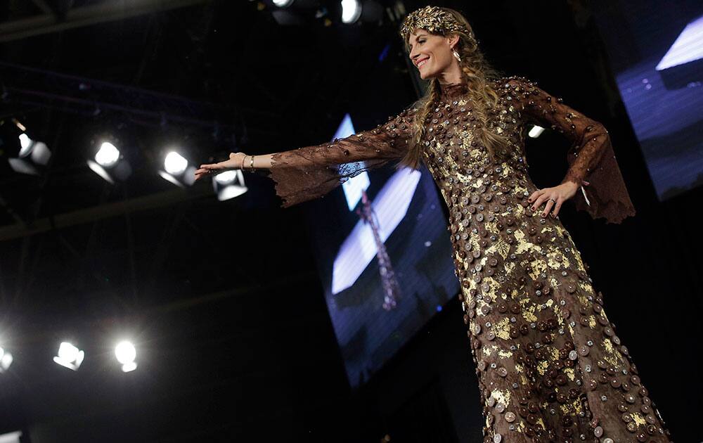 A model presents a chocolate studded dress during a show as part of the chocolate fair in Paris.