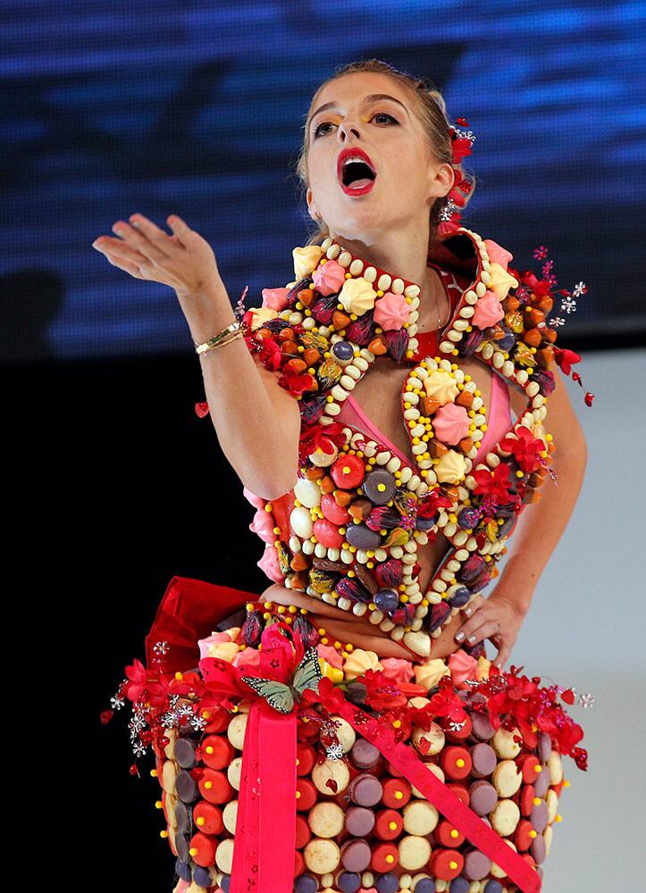 A model presents a chocolate studded dress during a show as part of the chocolate fair in Paris.