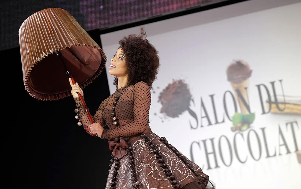 A model presents a chocolate studded dress during a show as part of the chocolate fair in Paris.