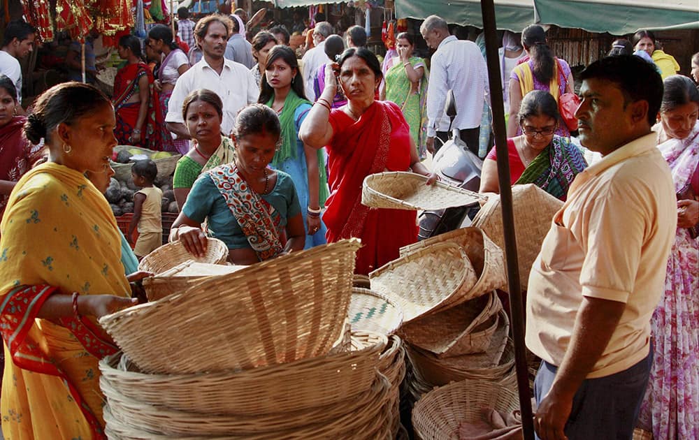 Women purchase bamboo-baskets and other things for the Chhath Puja festival in Gurgaon.