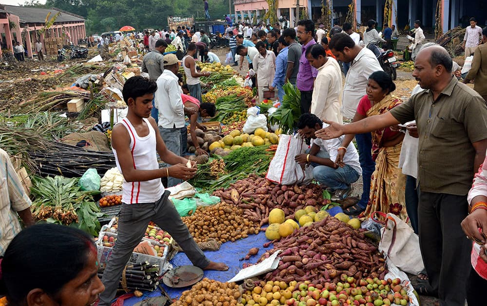 Devotees purchase fruits for the Chhath Puja festival at Krishi Bazar in Dhanbad.