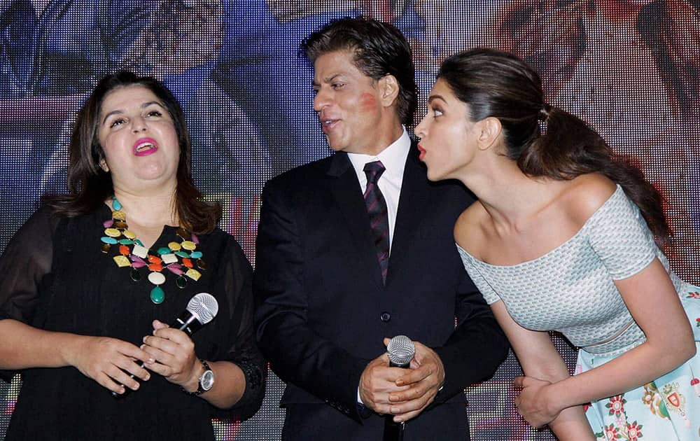 Bollywood actor Shah Rukh Khan with filmmaker Farah Khan and actress Deepika Padukone during the launch of special video song of film Happy New Year.