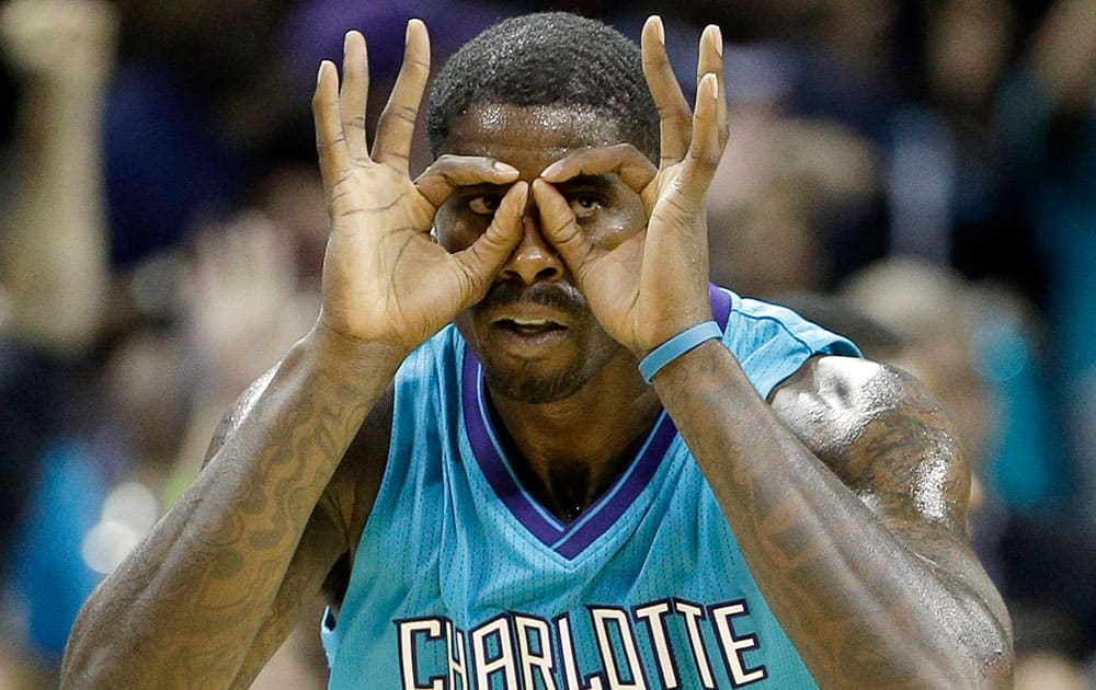 Charlotte Hornets' Marvin Williams (2) reacts after making a three point basket against the Milwaukee Bucks during the second half of an NBA basketball game in Charlotte, N.C.