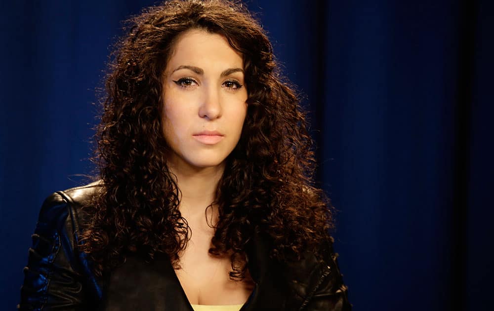 Actress Shoshana Roberts is seen during an interview at Associated Press headquarters in New York. Roberts starred in a video discretely made by man walking in front of her as she walked the streets of New York City and endured dozens of unsolicited catcalls during the course of a single day. 