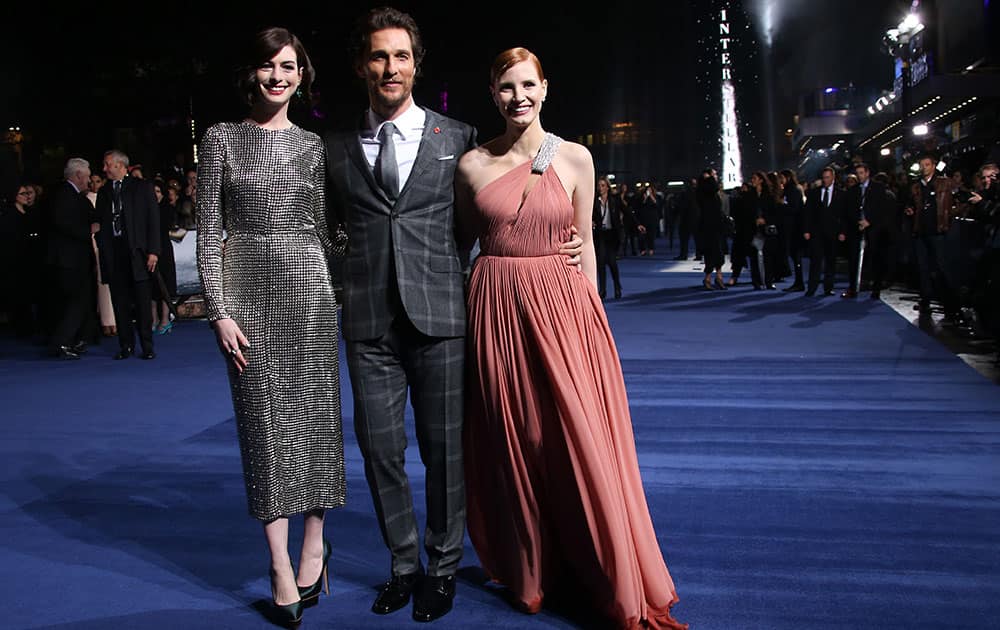 Actors Anne Hathaway, Matthew McConaughey and Jessica Chastain pose for photographers upon arrival at the premiere of the film Interstellar, in central London.