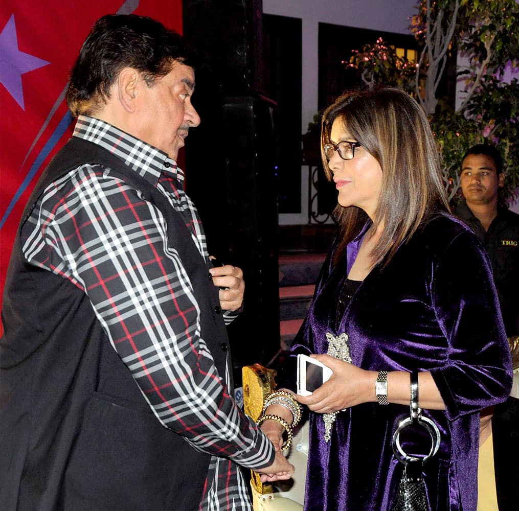 Bollywood Stars Shatrughan Sinha shakes hand with Zeenat Aman during a function, in Bhopal.