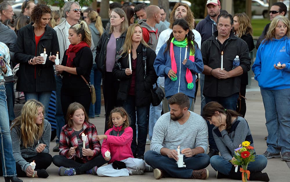 A vigil is held for the Strack family at Pioneer Park in Provo, Utah after the family of five who were mysteriously found dead in their Springville home last Saturday.