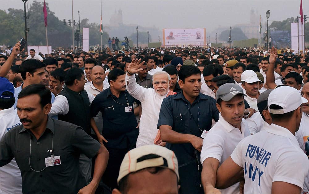 Prime Minister Narendra Modi waves during the Run for Unity at Rajpath on the occasion of Sardar Vallabhbhai Patels birth anniversary in New Delhi.