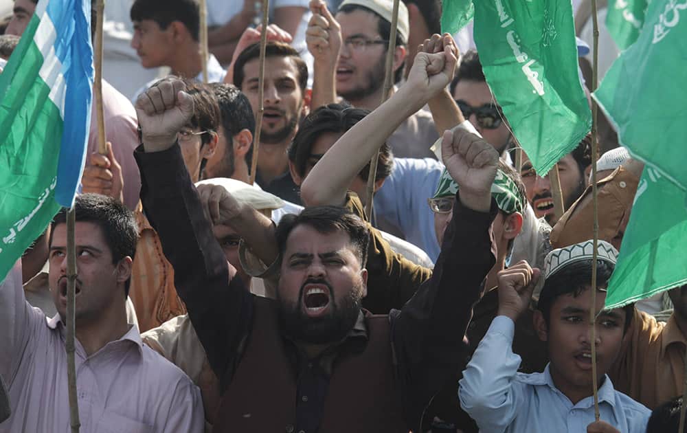 Supporters of Pakistan's religious party Jamaat-e-Islami rally to condemn the court verdict against Bangladeshi religious leader, in Lahore, 