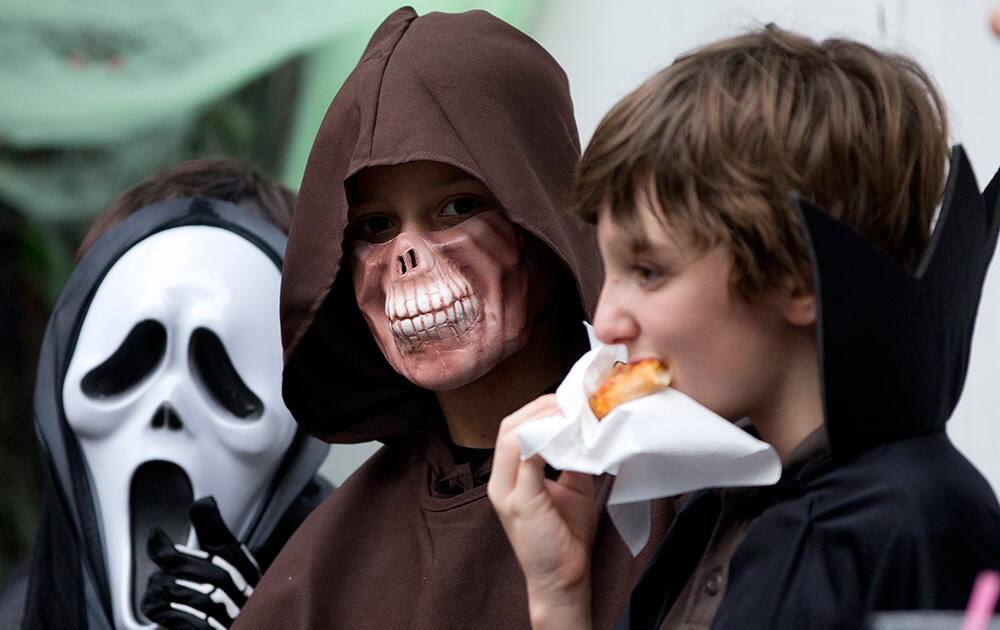 Young boys dressed for Halloween prepare to trick-or-treat in a housing compound in South Jakarta district in Jakarta.