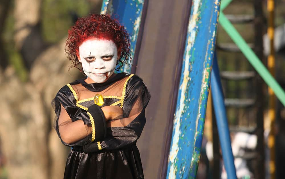 A child poses for photos during a Halloween party in a Johannesburg Suburb.