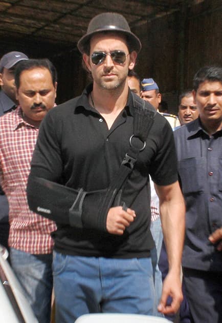 Bollywood actor Hrithik Roshan leaves the Bandra family court after he and Sussane were granted divorce in Mumbai.