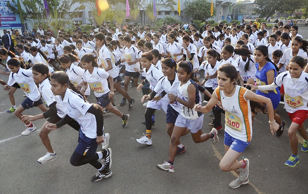Girls take part in 10 km Girls-Open Mini marathon event on the occasion of Madhya Pradesh Foundation Day in Bhopal.