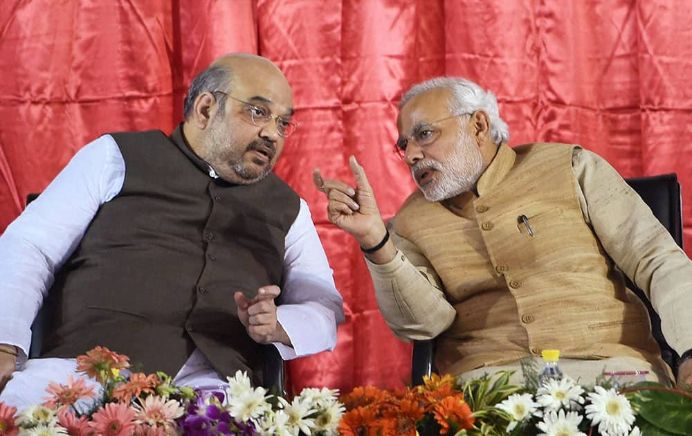 Prime Minister Narendra Modi with BJP President Amit Shah during the launch of Bharatiya Janata Partys (BJP) membership drive at party headquarters in New Delhi.