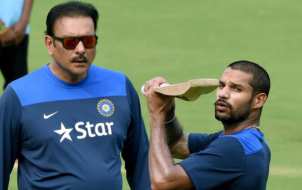 Team Indias director of Cricket Ravi Shastri with Shikhar Dhawan during a training session at Barabati Stadium in Cuttack.