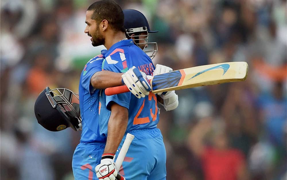 Indian batsman Shikhar Dhawan hugs Ajinkya Rahane after completing his century during 1st ODI match against Sri Lanka in Cuttack.
