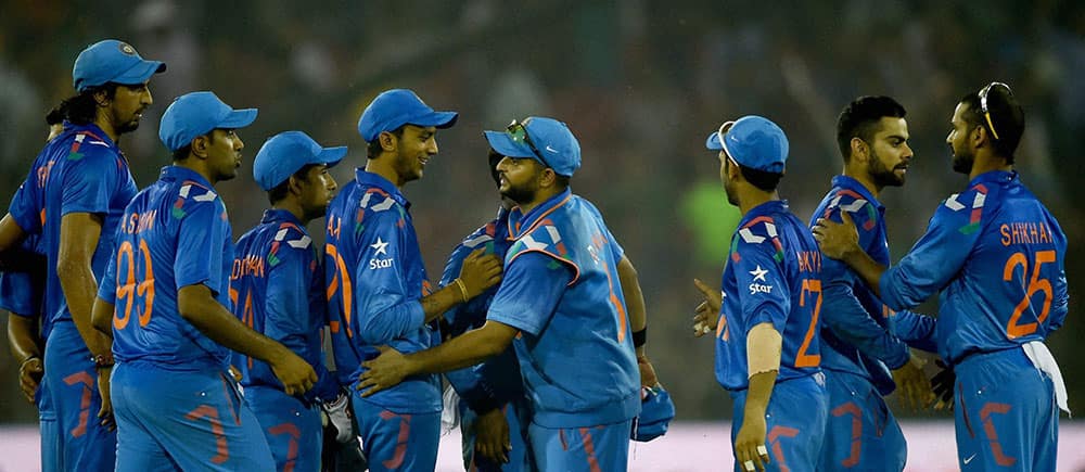 Indian cricketers celebrate after winning 1st ODI match against Sri Lankan in Cuttack.