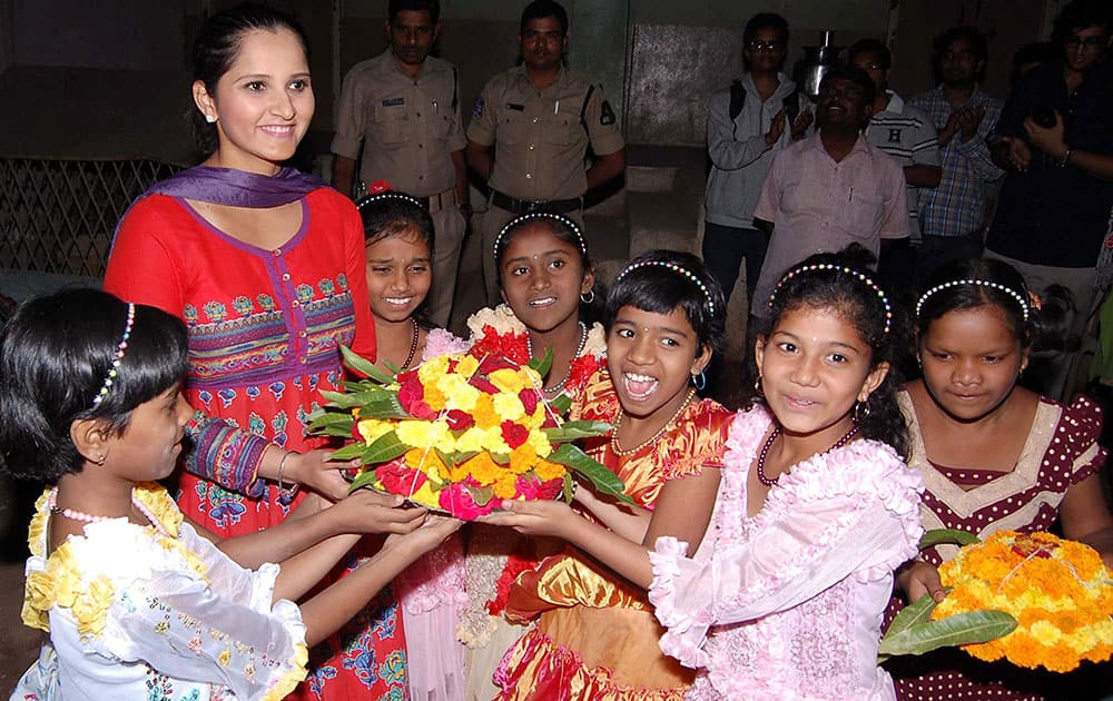 Indian tennis player Sania Mirza meeting with minor girl inmates at a residential hostel Rainbow Home at Musheerabad, Secunderabad.