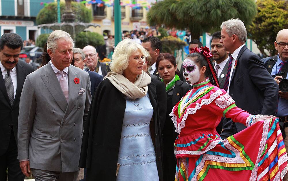 Britain's Prince Charles and Camilla Duchess of Cornwall walk after togehter during a visit to the City of Pachuca, Mexico.