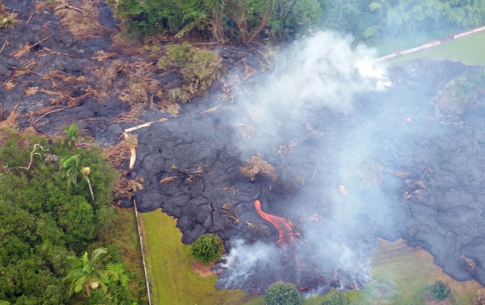 aerial photo provided by Pete Stachowicz of Paradise Helicopters, lava flows around the town of Pahoa on the Big Island of Hawaii.