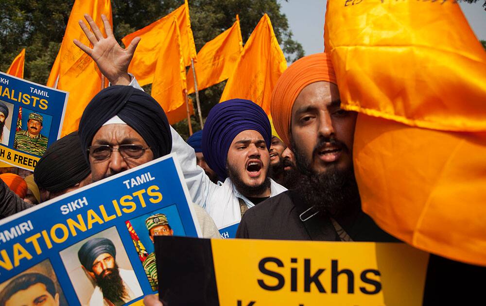 Indian Sikhs shout slogans during a protest demanding justice for victims of the 1984 anti-Sikh riots in New Delhi, India.