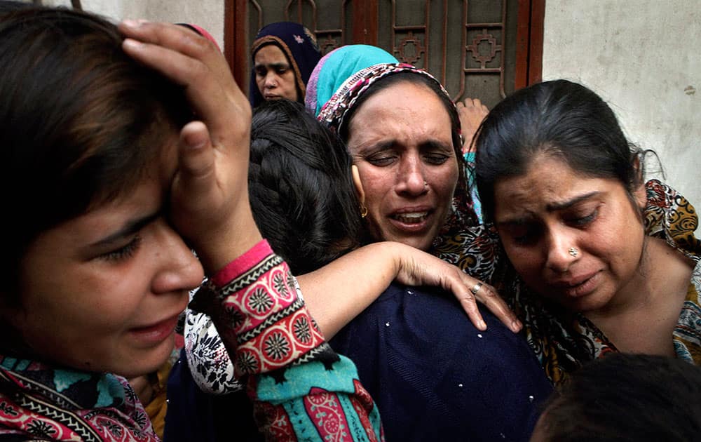 Pakistani women mourn for their family member who was killed in a Sunday suicide bombing, in Lahore, Pakistan.