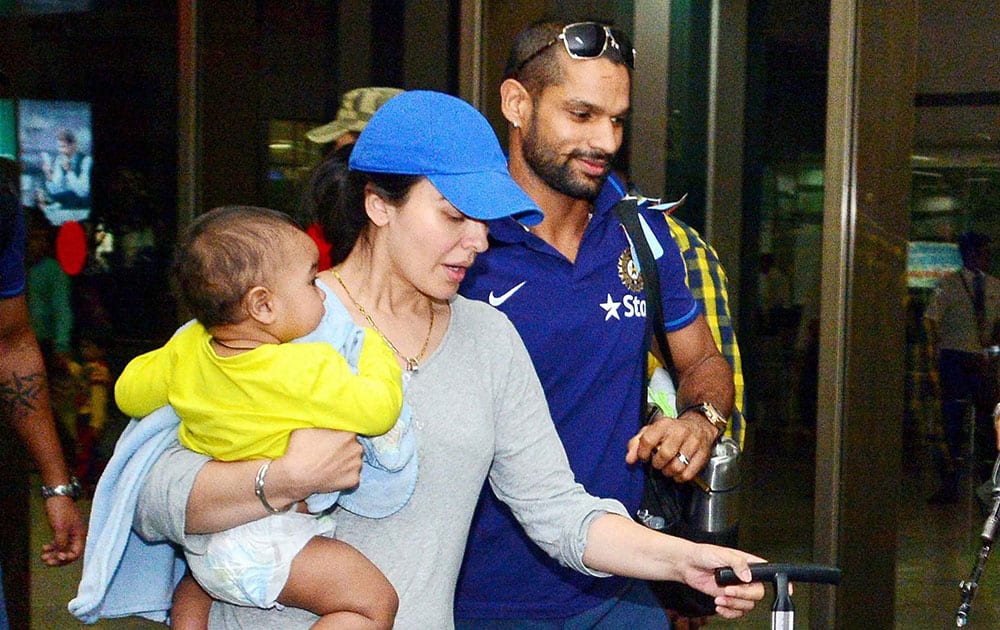 India cricket player Shikhar Dhwan along with his wife arrives at the Intl Airport in Ahmedabad . The 2nd ODI between India and Sri Lanka will be played on 6th November.
