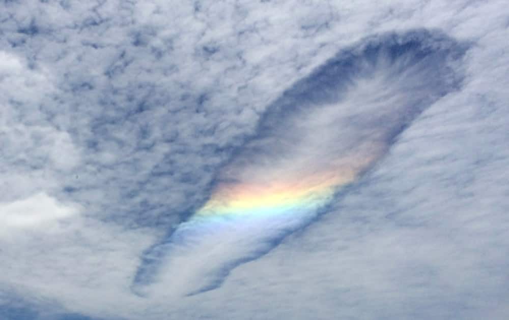 This photo taken with smartphone camera, a fallstreak hole forms in the sky over Wonthaggi, Australia. A fallstreak hole is a circular gap that appears in high clouds, when a section of the cloud freezes. The ice crystals are heavy, so they fall out of the cloud, leaving a hole. It is a relatively rare phenomenon.