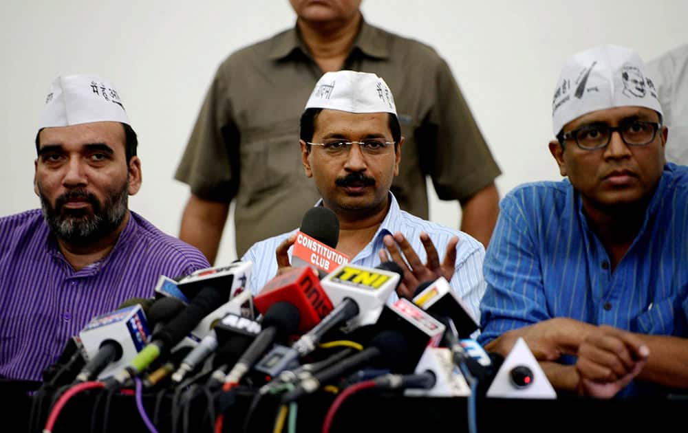 AAP convener Arvind Kejriwal addressing a press conference in New Delhi. Party leaders Gopal Rai and Ashutosh are also seen.