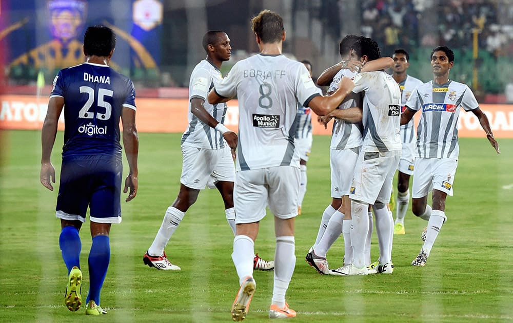 Atletico De Kolkata players celebrate after scoring a goal against Chennaiyin FC during their Indian Super League match in Chennai.