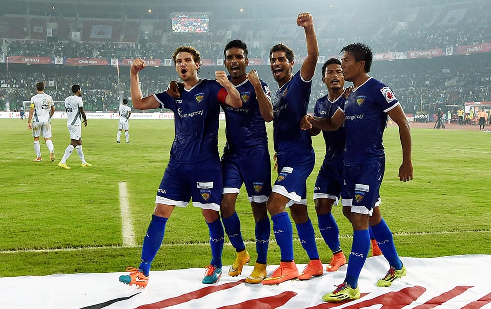 Chennaiyin FC players celebrate after scoring a goal against Atletico De Kolkata during the Indian Super League match in Chennai.