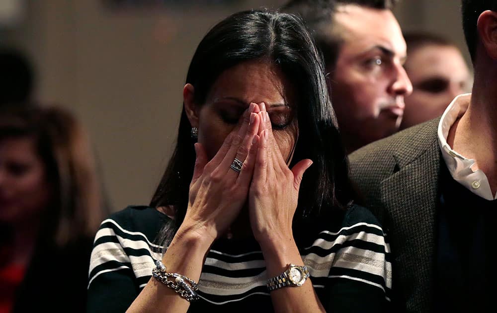 Jahala Grous, of Essex, Conn., cries as incumbent Democratic Gov. Dannel Malloy is shown addressing supporters on a television screen at an election night party for Republican candidate for governor Tom Foley, in Old Greenwich, Conn.