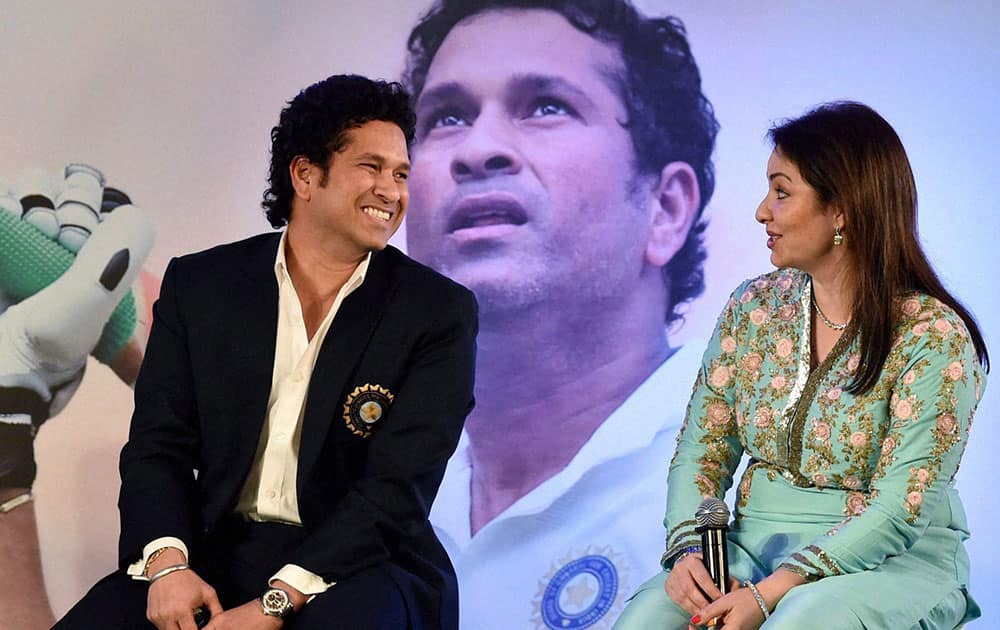  Cricket legend Sachin Tendulkar with wife Anjali during the release of his autobiography Playing It My Way in Mumbai.