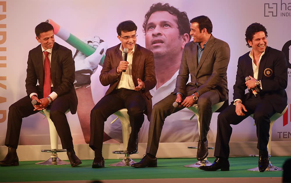 Retired cricket great Sachin Tendulkar, shares a lighter moment with former cricketers Rahul Dravid, Saurav Ganguly and VVS Laxman during the launch of his autobiography, 'Playing It My Way,' in Mumbai.