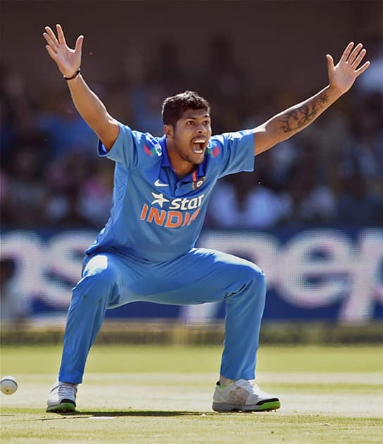 Umesh Yadav celebrates after taking the wicket of Srilankan batsman Kusal Parera during the India VS Sri Lanka ODI match in Ahmedabad.