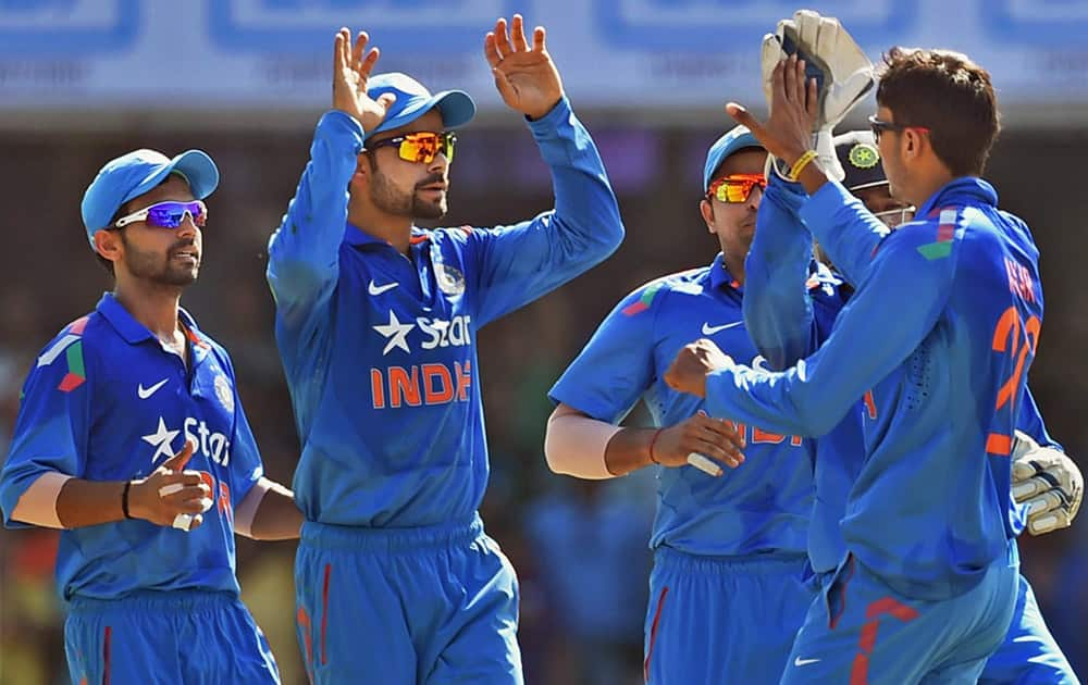 Players celebrate the wicket of Sri Lankas T Dilshan during the 2nd ODI cricket match in Ahmedabad.