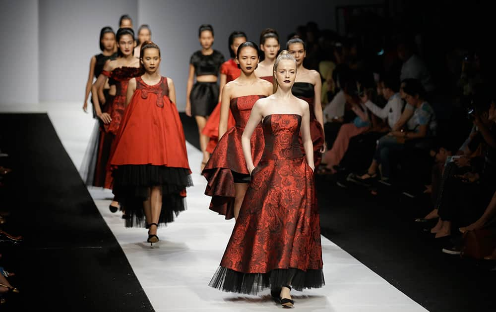 Models display creations by Verena Mia during the Jakarta Fashion Week 2015 in Jakarta, Indonesia.