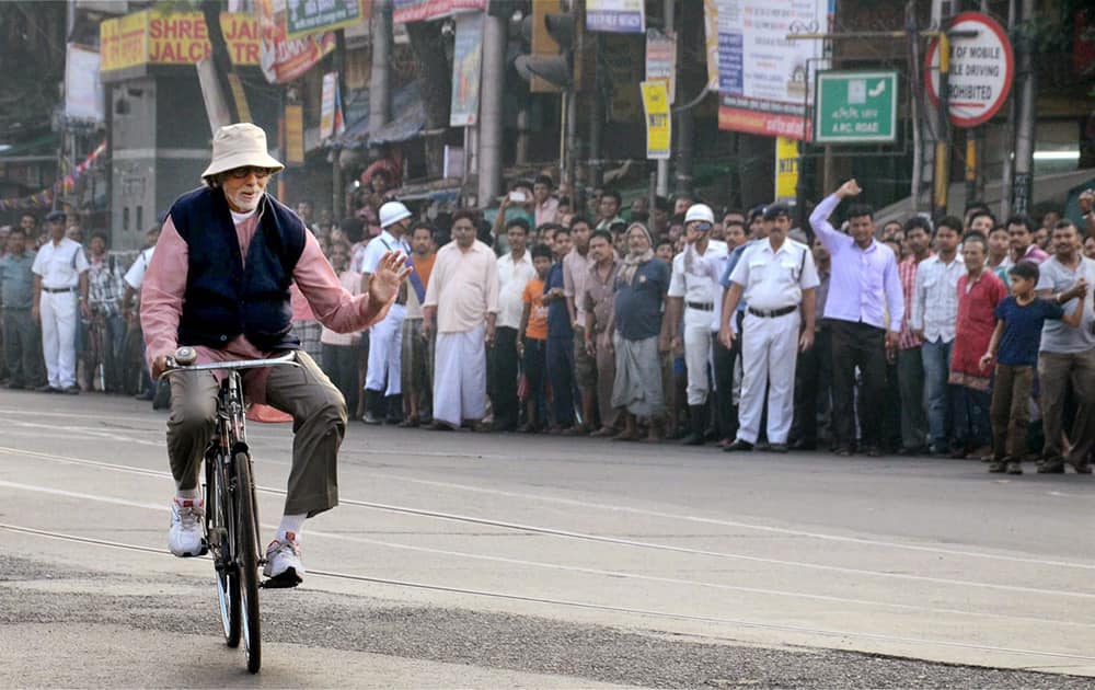 Amitabh Bachhan rides a bicycle during the shooting of his upcoming film Piku in Kolkata.