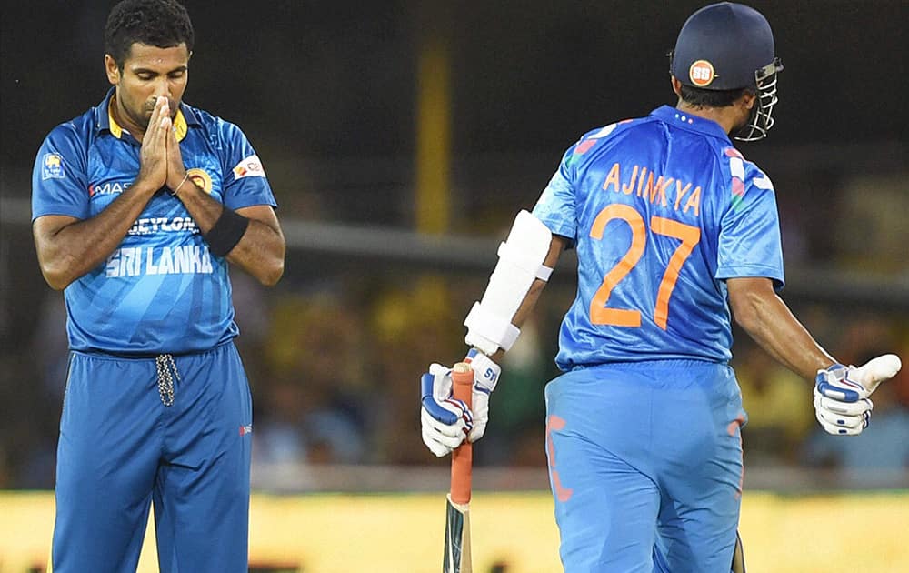 Sri Lankan bowler Dhammika Prasad celebrates the wicket of Indian batsman Ajinkya Rahane during the 2nd ODI cricket match played in Ahmedabad.