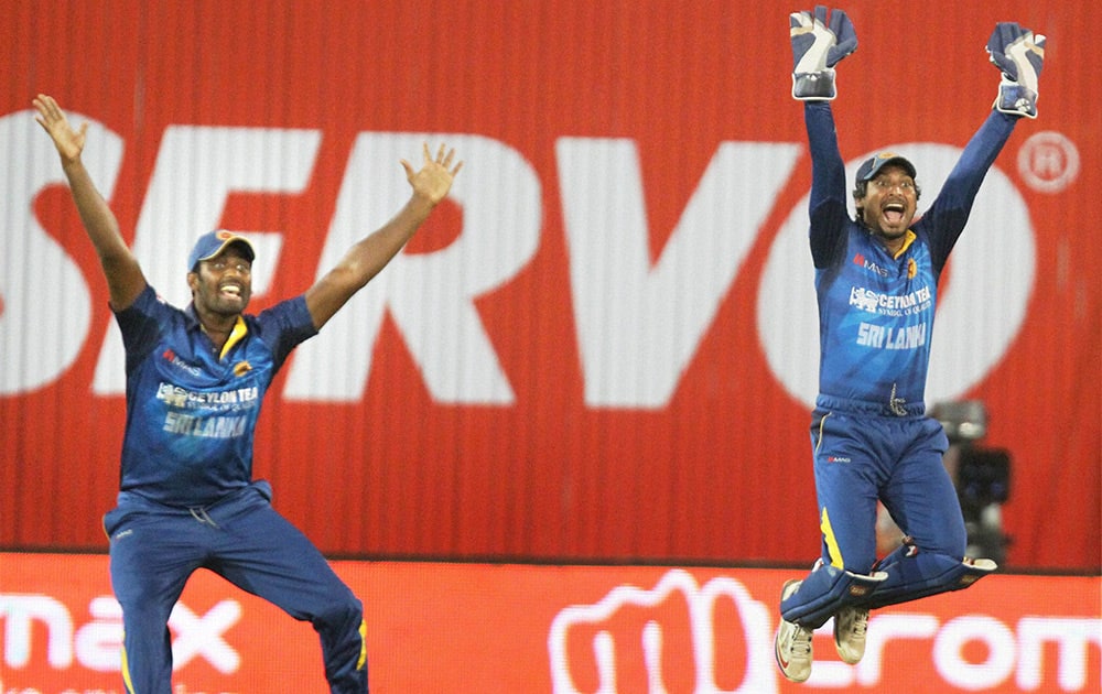 Sri Lankan team players appeal for the wicket of Indian Batsman Shikar Dhawan during the 2nd ODI cricket match in Ahmedabad.