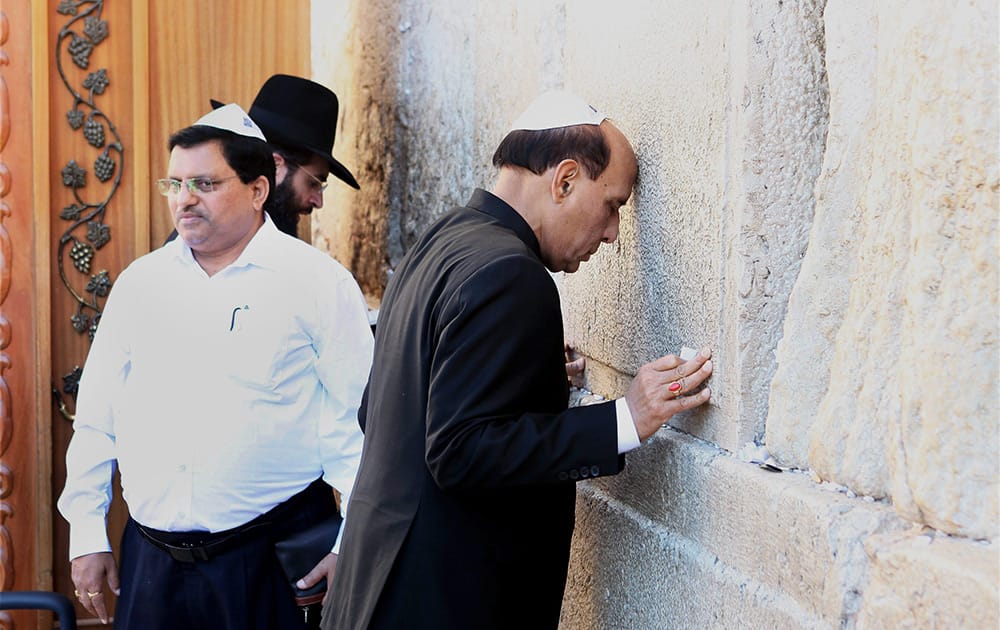 Union Home Minister Rajnath Singh prays at the Judaisms holy site, Western Wall during his visit to Israel in Jerusalem.